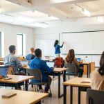 Adults with laptops learning technology in a classroom