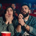 a couple, watching a horror movie