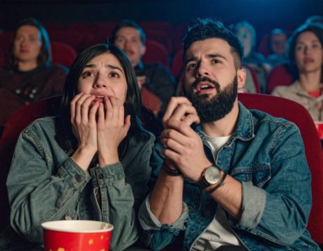 a couple, watching a horror movie
