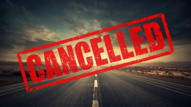 A long desert road under a dramatic sky, representing the "roads not taken" in Call of Duty history, is stamped with a large red "CANCELLED" logo, symbolizing the 10 cancelled Call of Duty projects.
