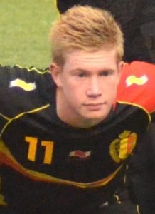 Close-up of Kevin De Bruyne wearing the black Belgium National Team jersey with number 11 during a 2013 match.