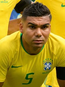 Close-up of Casemiro, Brazilian national team midfielder, wearing the yellow Brazil jersey with the CBF crest during a match.