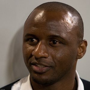 Close-up portrait of Patrick Vieira, one of football's legendary captains, looking off-camera.
