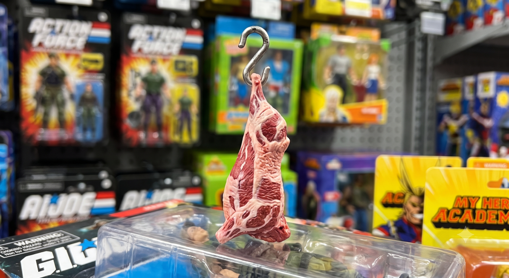 AI-generated illustration of the bizarre 2007 Jakks Pacific Rocky hanging meat carcass action figure accessory.