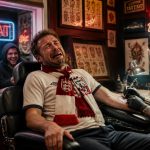 Crying football fan in a scarf getting a forfeit tattoo after a lost sports bet while his friends laugh through the window.